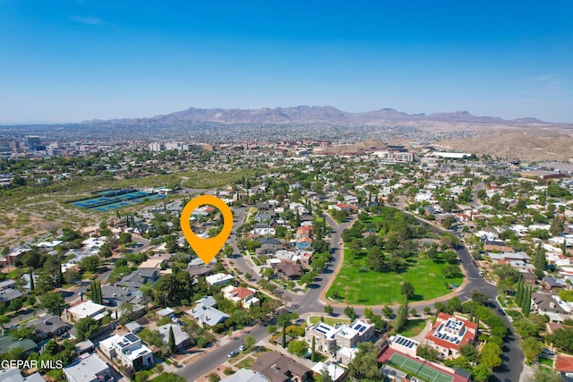 birds eye view of property with a mountain view