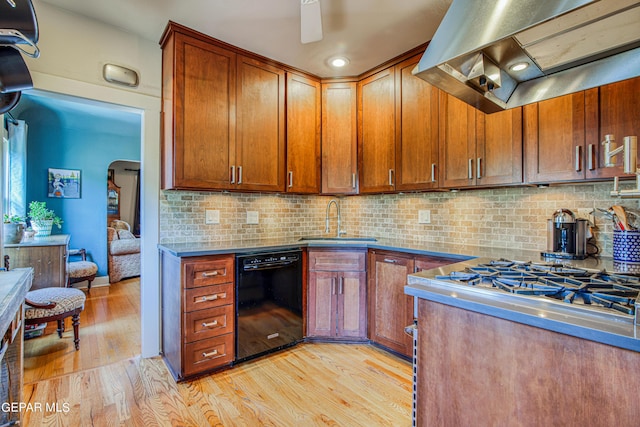 kitchen with island range hood, dishwasher, light wood-type flooring, and backsplash