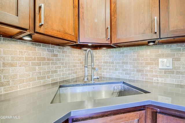 interior details with backsplash and sink