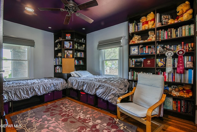 bedroom featuring ceiling fan and hardwood / wood-style floors