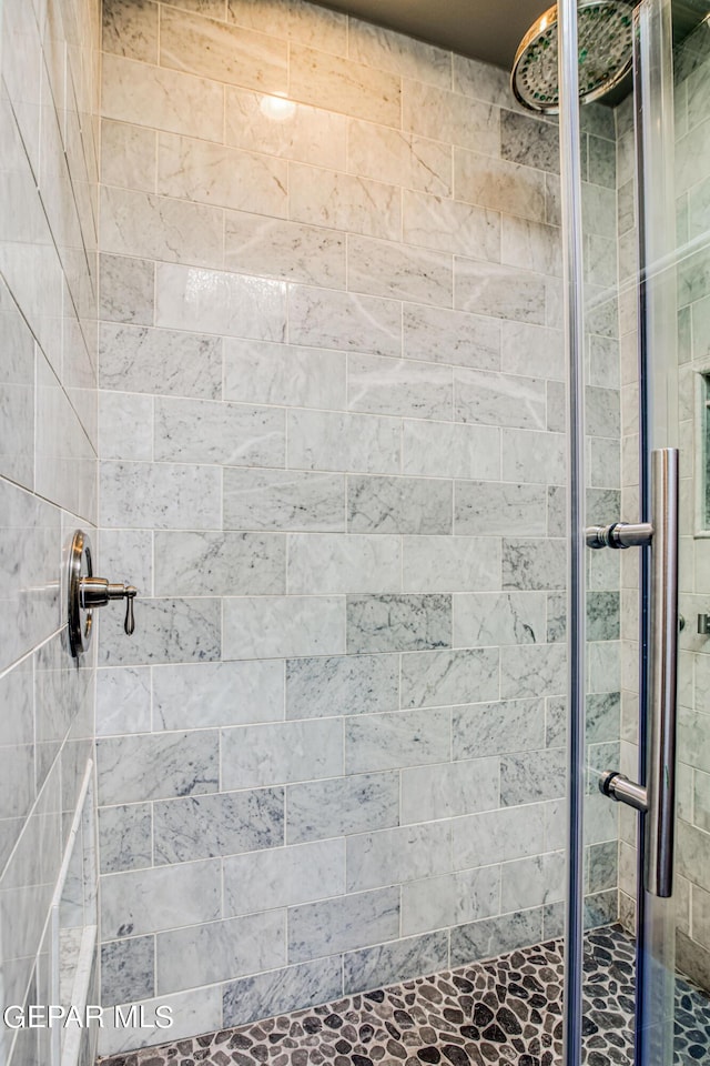 bathroom with an enclosed shower