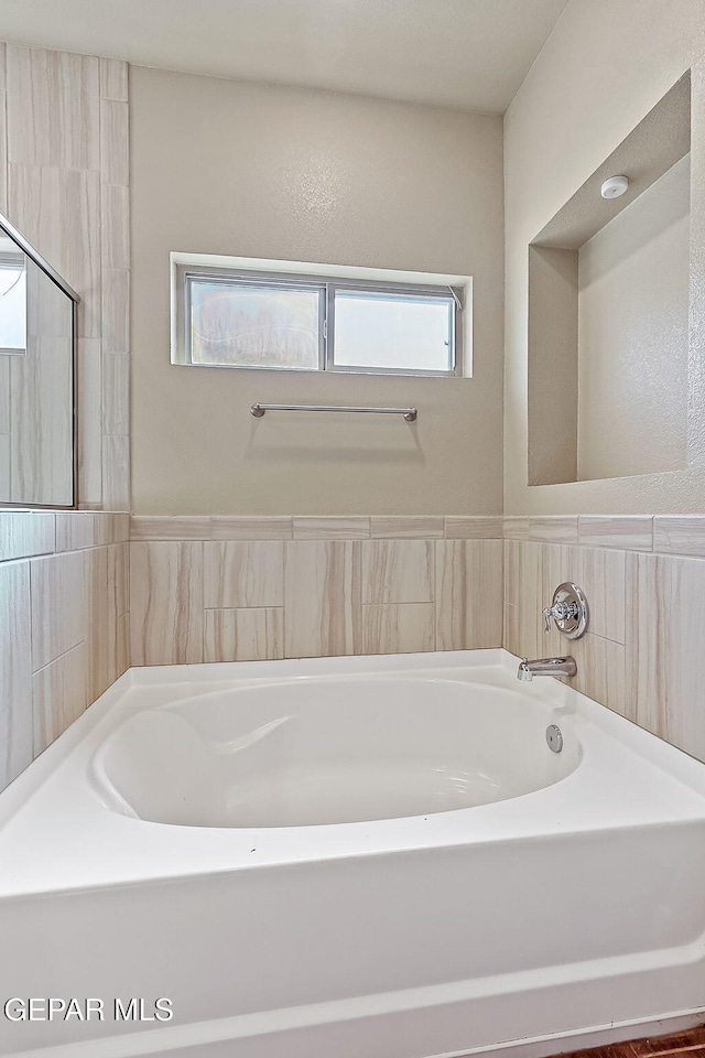 bathroom featuring a tub