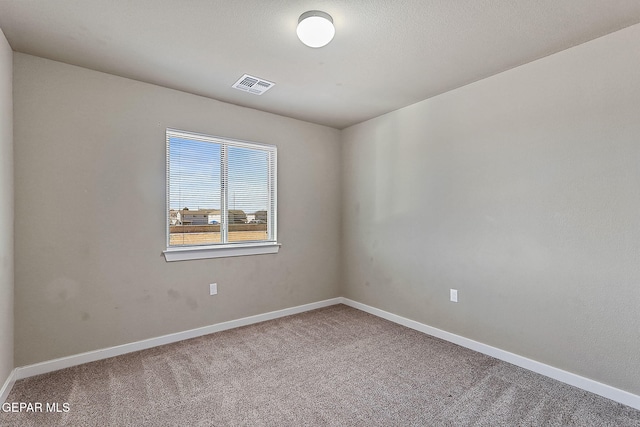 unfurnished room featuring carpet flooring