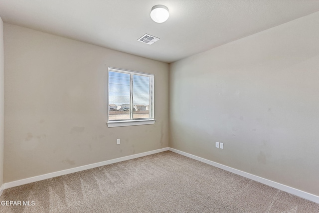 unfurnished room featuring carpet flooring