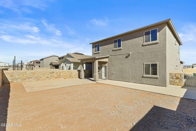 rear view of house with a patio