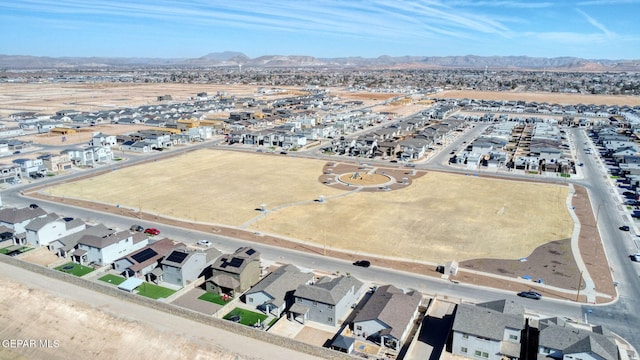 birds eye view of property with a mountain view