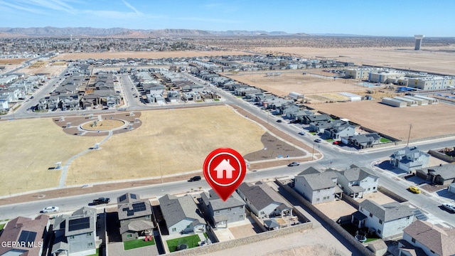 birds eye view of property featuring a mountain view