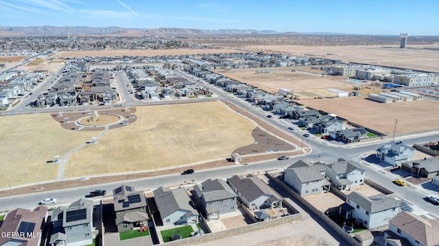 birds eye view of property featuring a mountain view