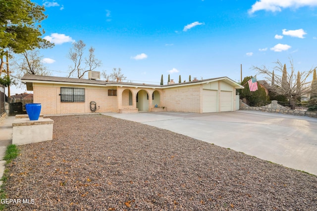 ranch-style house featuring a garage