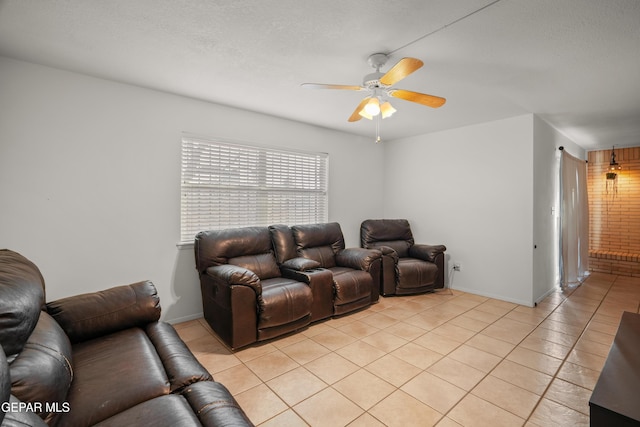 living room with light tile patterned floors, a textured ceiling, and ceiling fan