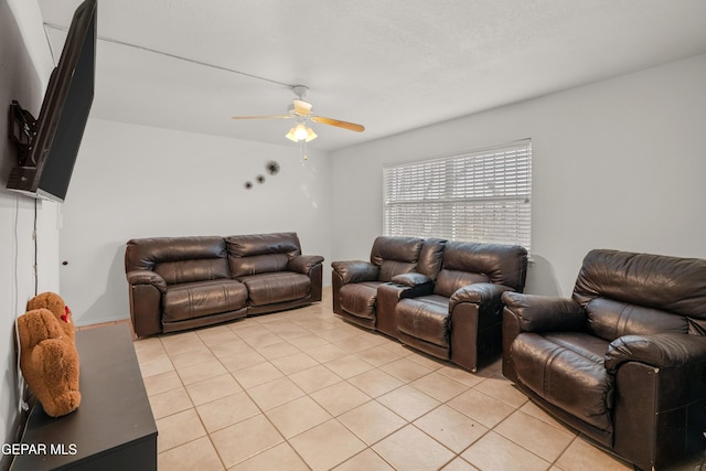 living room featuring light tile patterned floors and ceiling fan