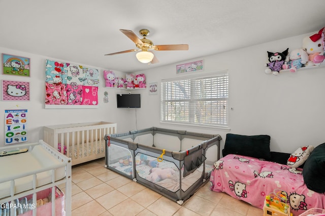 bedroom featuring light tile patterned floors and ceiling fan