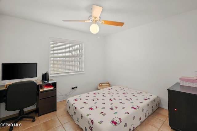 tiled bedroom featuring ceiling fan