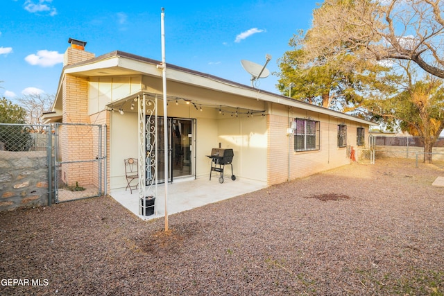 rear view of house featuring a patio