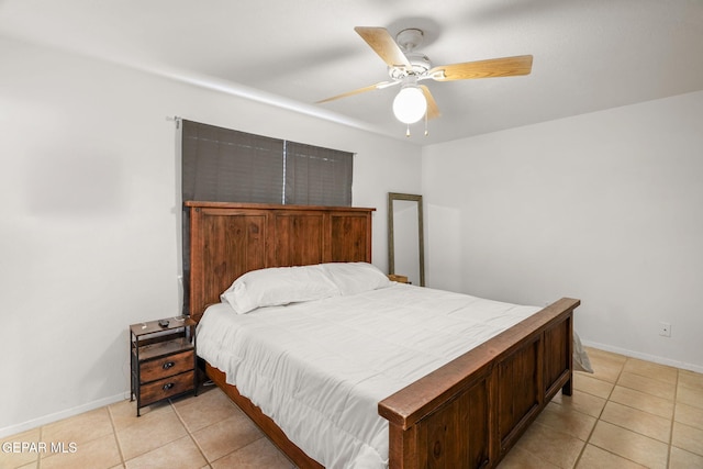 tiled bedroom featuring ceiling fan