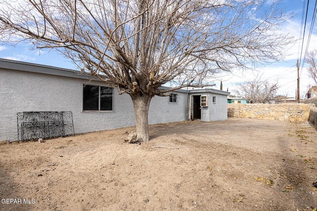 exterior space with driveway and fence