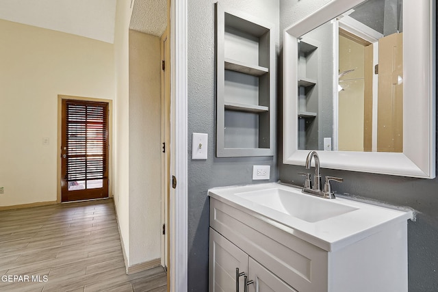 bathroom featuring vanity and built in features