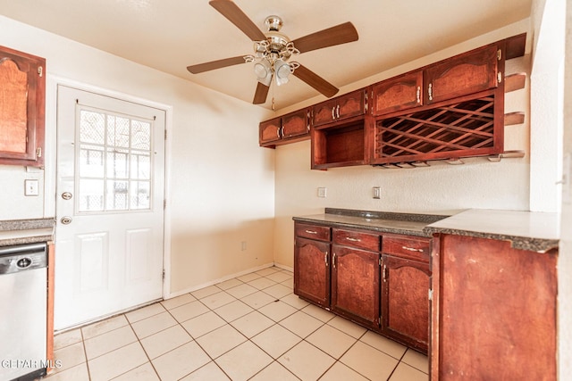 kitchen featuring ceiling fan, dishwashing machine, and light tile patterned floors