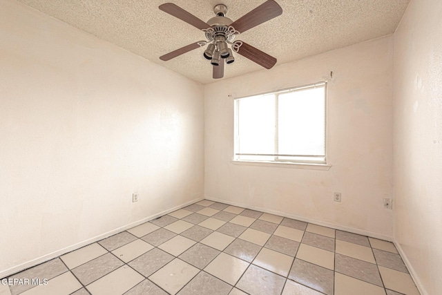 empty room featuring ceiling fan and a textured ceiling