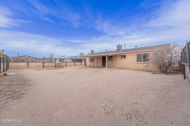 rear view of property featuring central AC