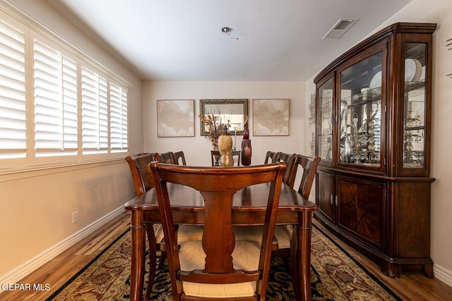 dining room featuring dark hardwood / wood-style flooring