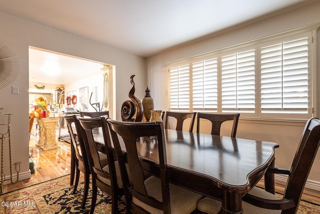 dining space featuring hardwood / wood-style flooring