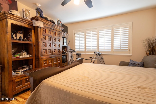 bedroom featuring ceiling fan and light wood-type flooring