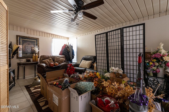 misc room featuring light tile patterned floors, wooden ceiling, and ceiling fan