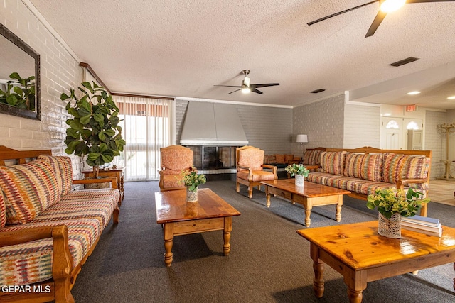 carpeted living room featuring brick wall, a fireplace, and ceiling fan