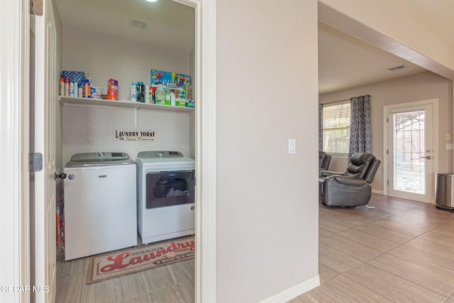 laundry room featuring separate washer and dryer