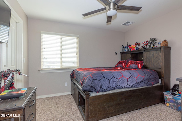 bedroom featuring light carpet and ceiling fan