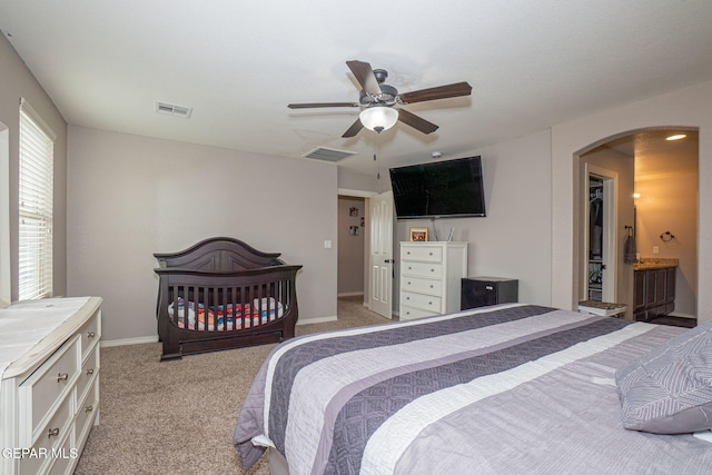 carpeted bedroom with ceiling fan