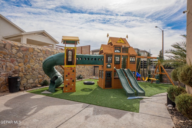 view of playground with a yard