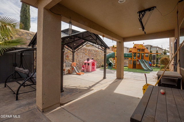 view of patio with a playground