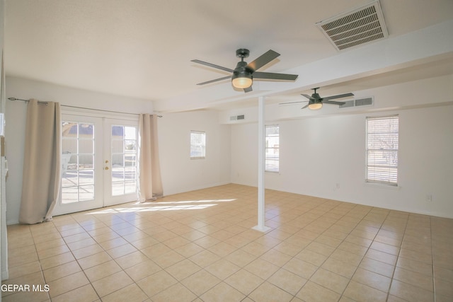 tiled empty room with french doors and ceiling fan