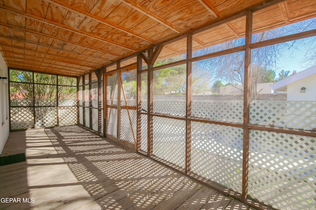 unfurnished sunroom with wooden ceiling