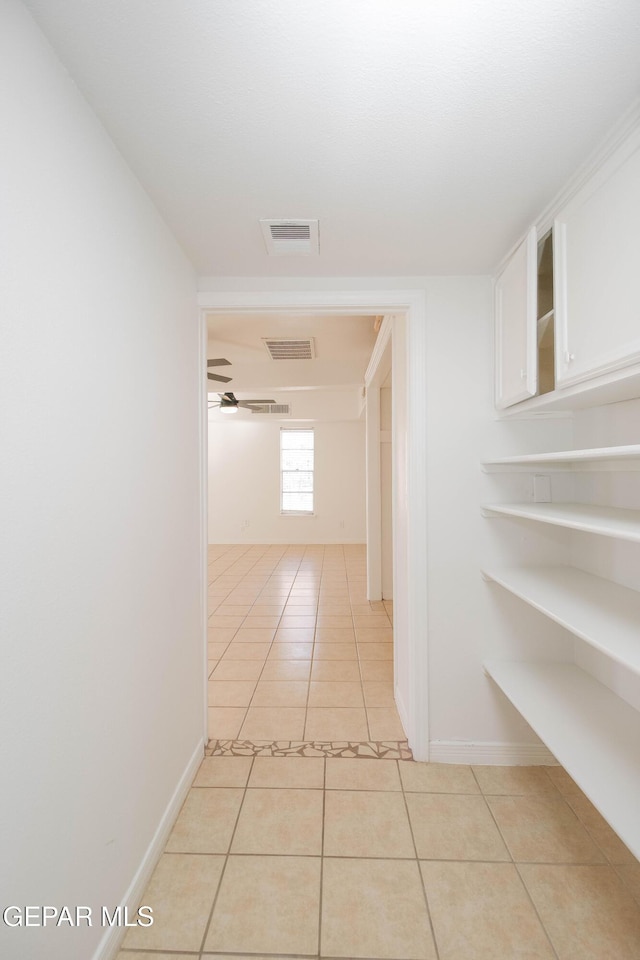 hallway featuring light tile patterned floors