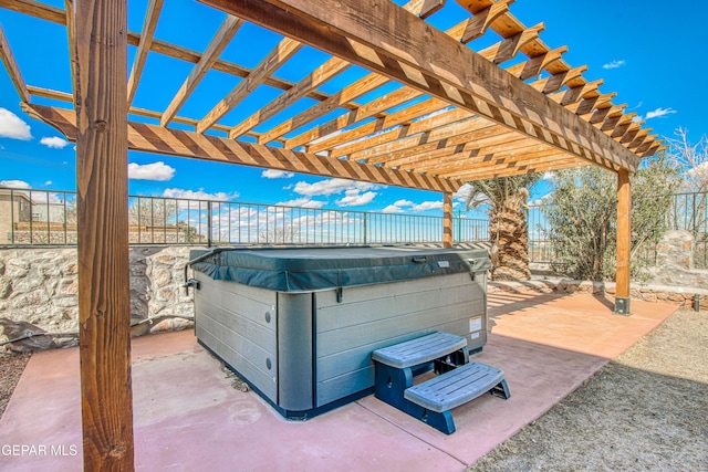 view of patio / terrace featuring a pergola and a hot tub