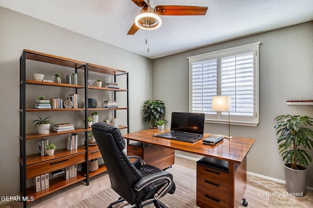 office featuring ceiling fan and a textured ceiling