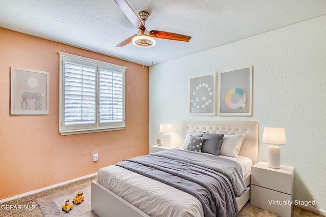 bedroom with ceiling fan and carpet flooring