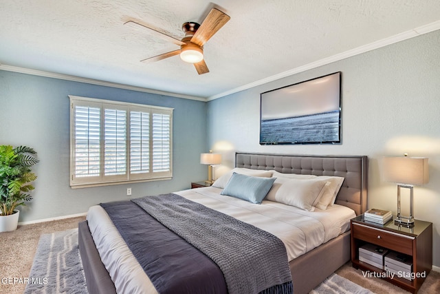 bedroom with crown molding, carpet flooring, ceiling fan, and a textured ceiling