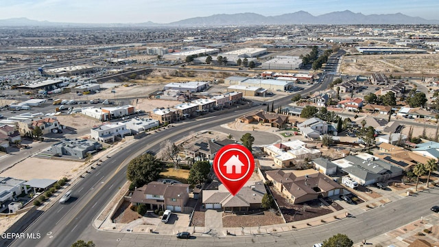 birds eye view of property featuring a mountain view