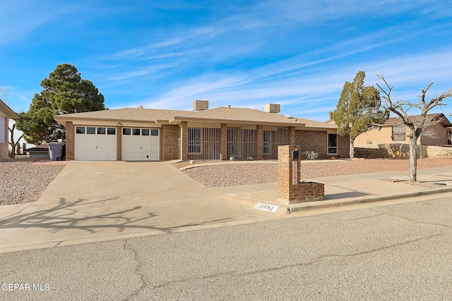 single story home with a garage