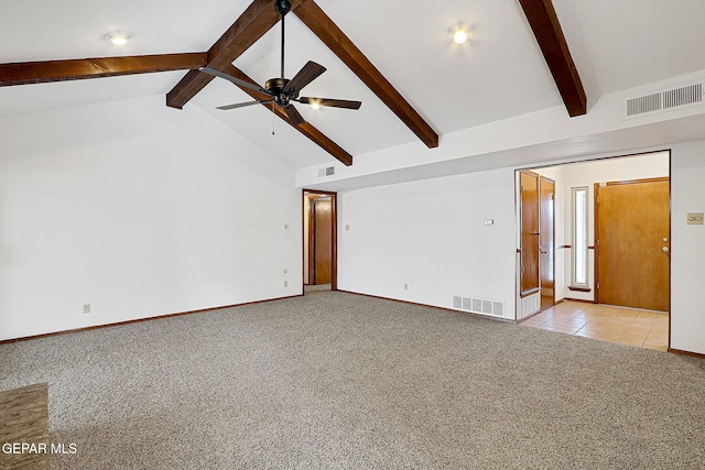 carpeted spare room featuring ceiling fan and vaulted ceiling with beams