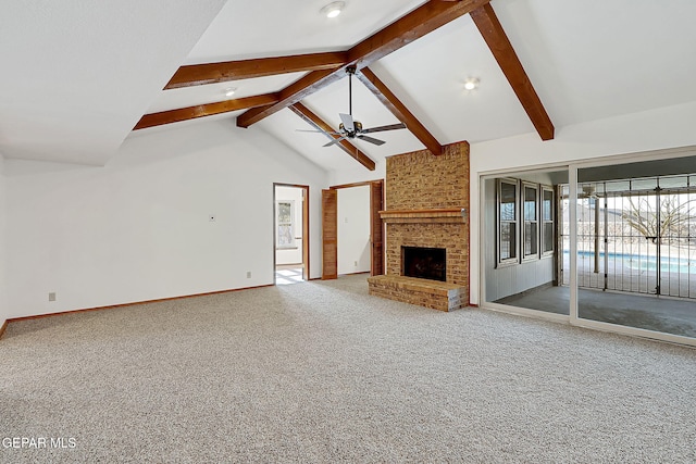 unfurnished living room featuring beam ceiling, high vaulted ceiling, carpet flooring, ceiling fan, and a fireplace