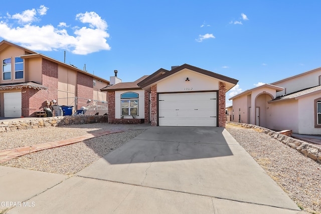 ranch-style home with a garage