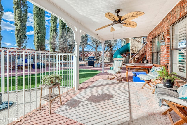 view of patio / terrace with a grill, ceiling fan, and a jacuzzi