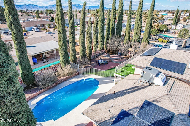 view of pool with a mountain view and a patio area