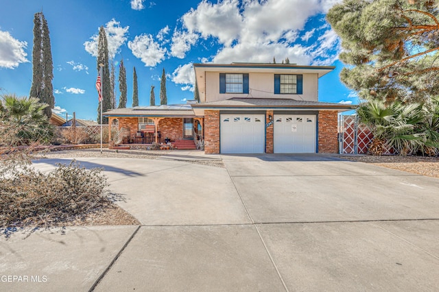 front of property with a porch and a garage