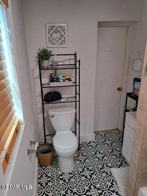 bathroom featuring tile patterned floors and toilet